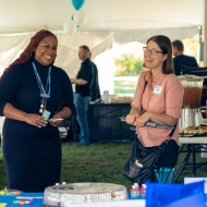 Two people laughing at job fair