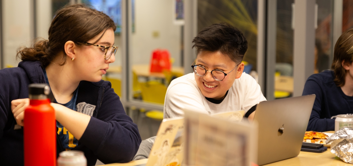 student looking at a computer during data fest 2025