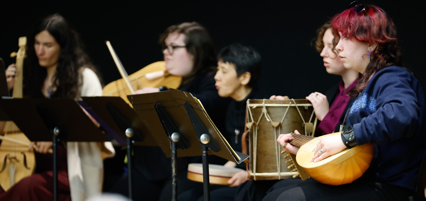 a group of students playing instruments at the early music program concert in december 24