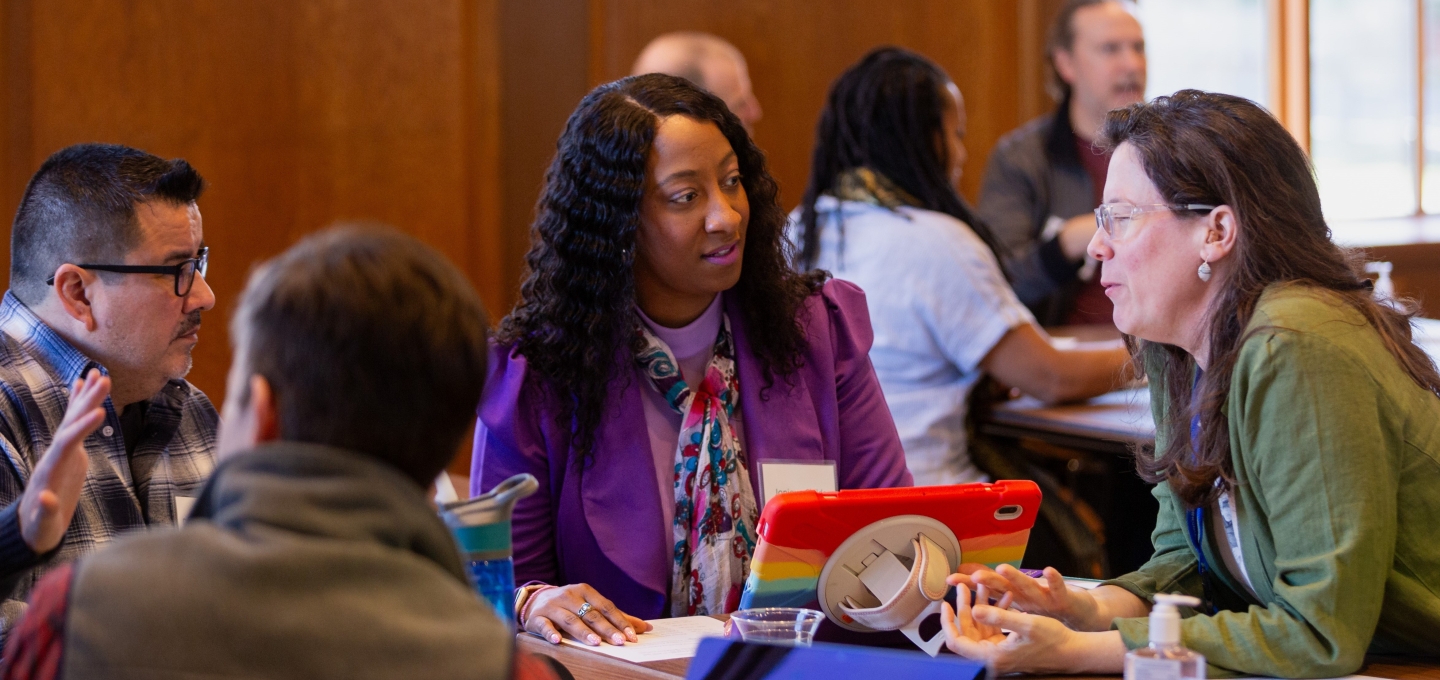 faculty members having a discussion