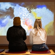 two people looking at an image