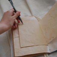 Anna_savina_image on pencil pointing at paper