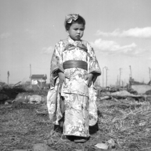 A girl dressed in a traditional Japanese kimono.