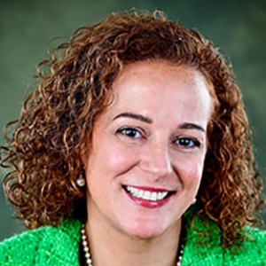 portrait of Robin Roeder against a green background